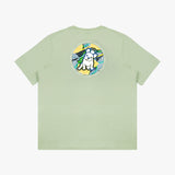 Flat lay of the light green T-shirt, showing the colorful circular dog graphic on the back.