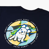 Close-up of the back graphic on the navy blue T-shirt, showing a dog wearing sunglasses in a colorful circular design with text around it.