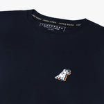 Close-up of the neckline and small decorative 'JB' logo on the chest of the navy blue T-shirt