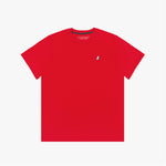 A red short-sleeved T-shirt with a small embroidered white dog logo on the upper left chest area. The neckline has a black inner lining with repeated 'JAMES BARK' branding, and the inside label displays the brand name.