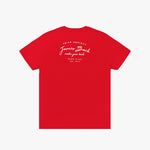 A red short-sleeved T-shirt displayed from the back, featuring white printed text that reads 'PRIVÉ SOCIETY' at the top, followed by 'James Bark' in a script font, 'make your bark' underneath, and 'BASED IN USA EST. 2015' at the bottom