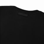 The black t-shirt laid flat, showing the back view.
