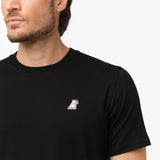 Close-up of the black t-shirt's left chest, showing a small logo design.