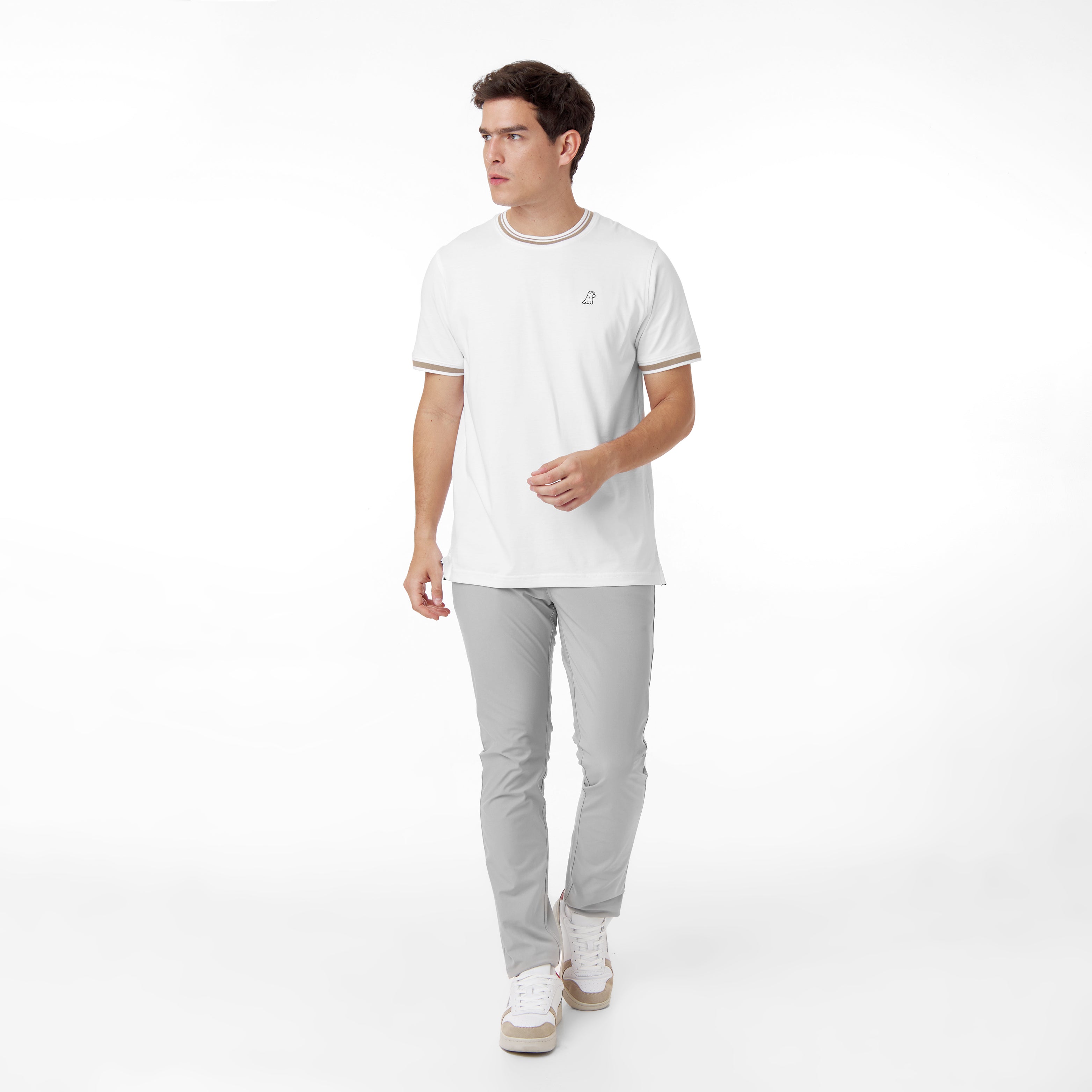 In the first image, the front view of a white T-shirt is displayed, featuring a clean design with beige stripes on the collar and sleeve cuffs, and a small embroidered logo on the chest for a subtle detail.