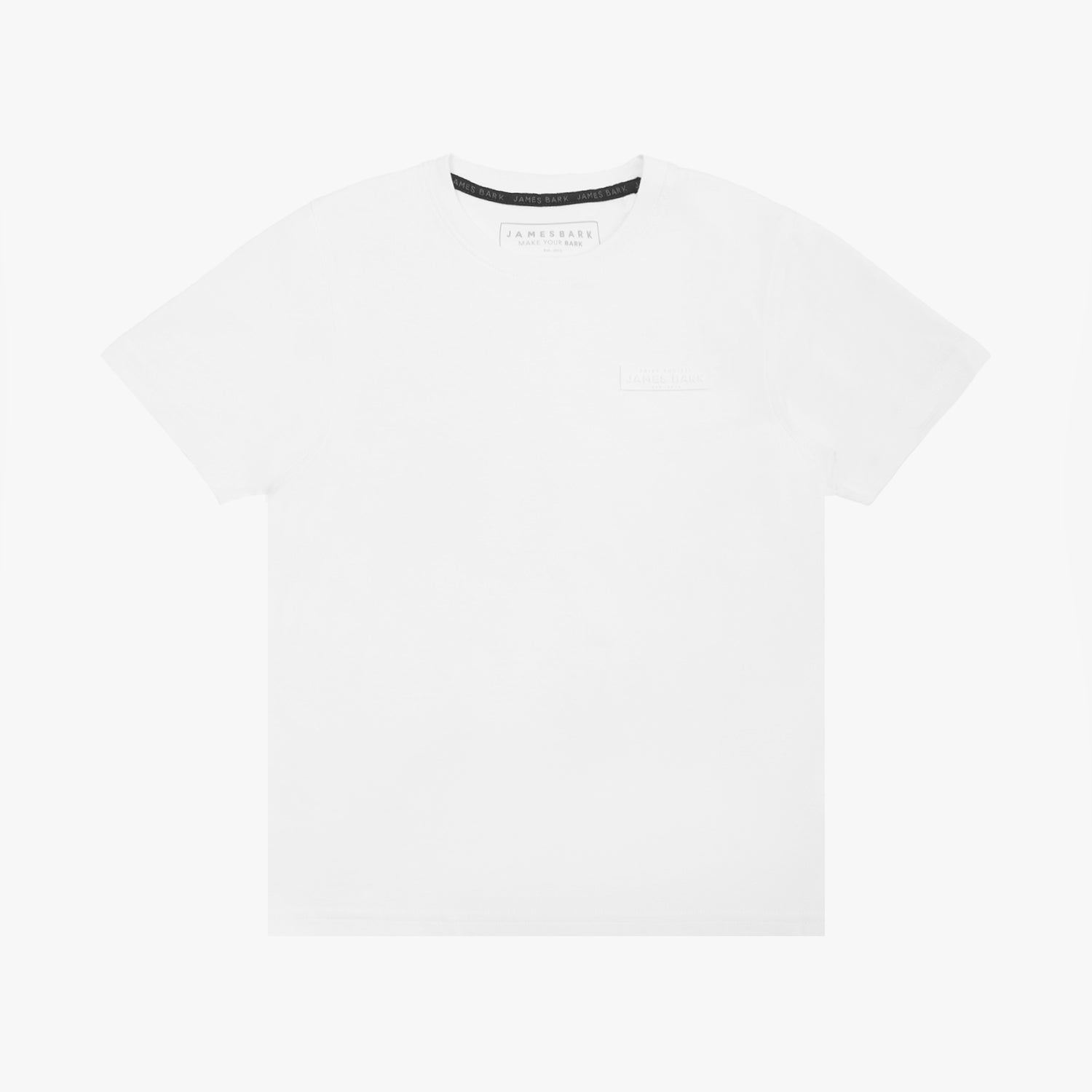 A white short-sleeved T-shirt featuring a subtle tonal logo patch on the upper left chest area that reads 'JAMES BARK.' The neckline includes a black inner lining with repeated 'JAMES BARK' branding, and the inside label also displays the brand name