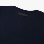 The navy blue t-shirt laid flat, showing the back view.