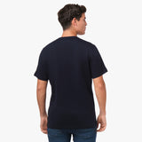 Back view of a man wearing a navy blue t-shirt, showing the plain back.