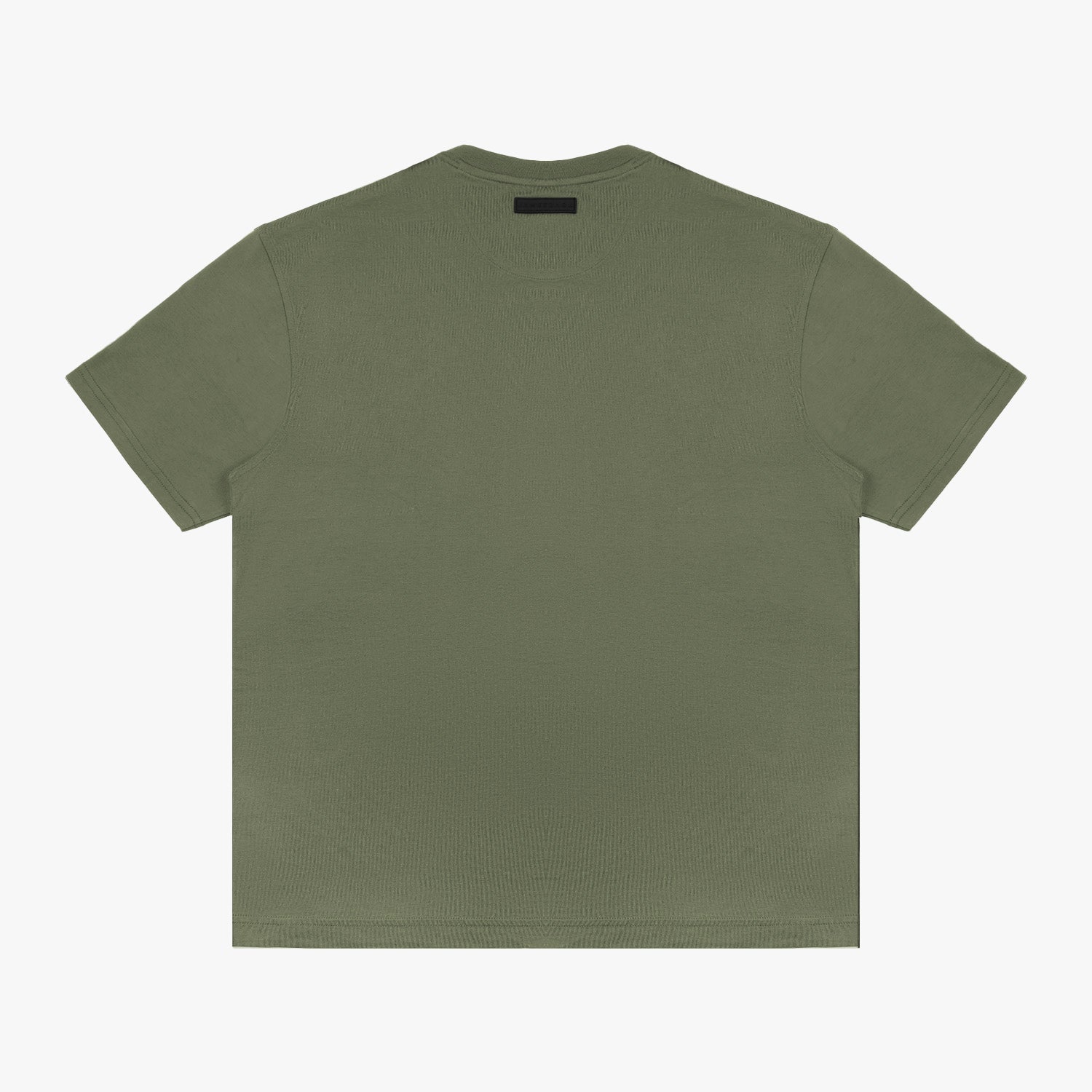 Full-body shot of the model wearing the olive green t-shirt, standing casually with one hand in his pocket.