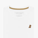 Close-up of the neckline of a white crew neck James Bark t-shirt, showing the brand label, contrast neck tape, and gold embroidered dog logo on the chest