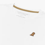Angled close-up of the neckline of a white crew neck James Bark t-shirt, highlighting the brand label, contrast neck tape, and gold embroidered dog logo