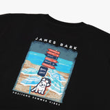 Close-up rear view of the t-shirt, focusing on the detailed beach scene with "James Bark" branding.