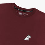 Flat-lay front view of the burgundy t-shirt with the small logo on the chest.