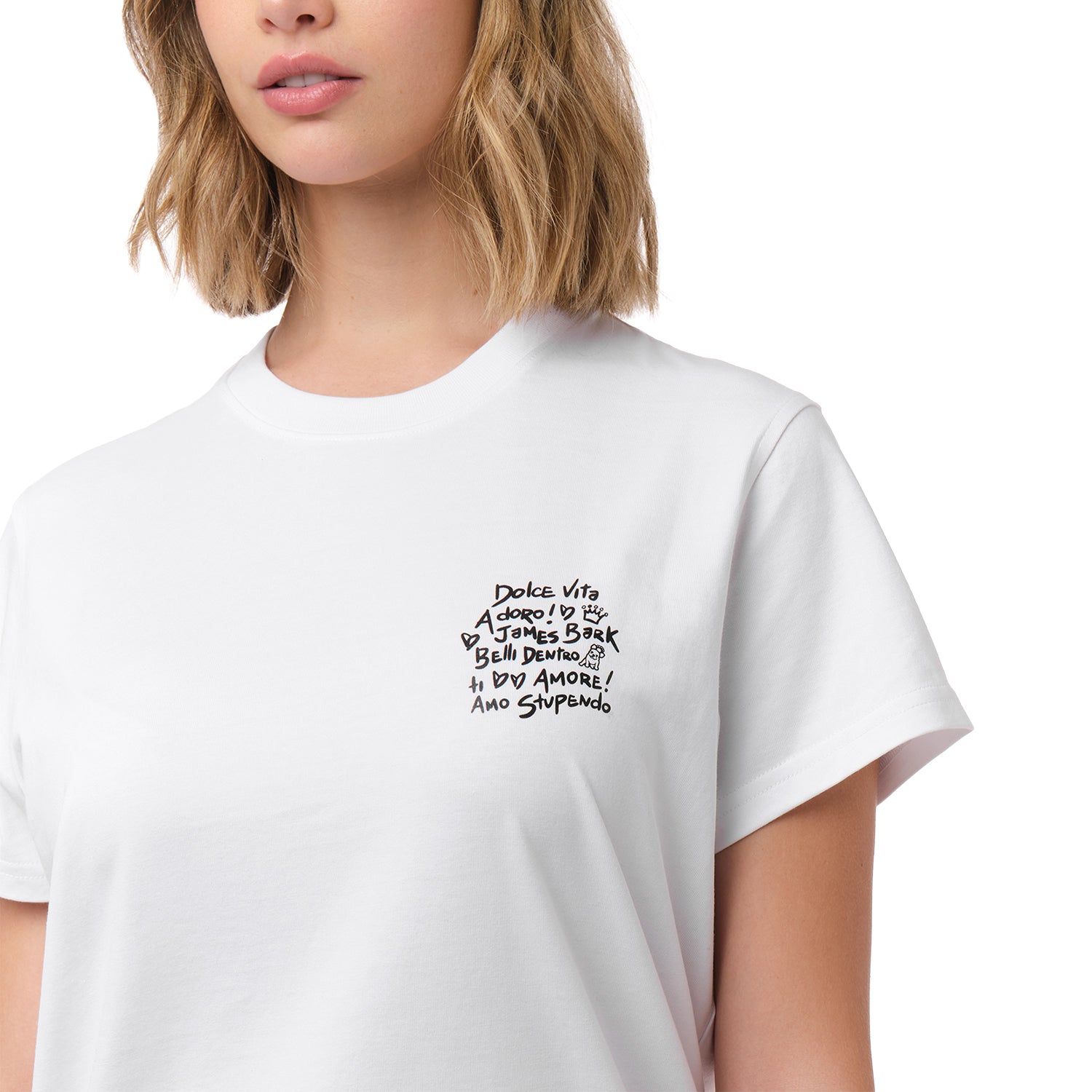 A close-up of the woman wearing the white T-shirt, focusing on the chest area and the black text design.