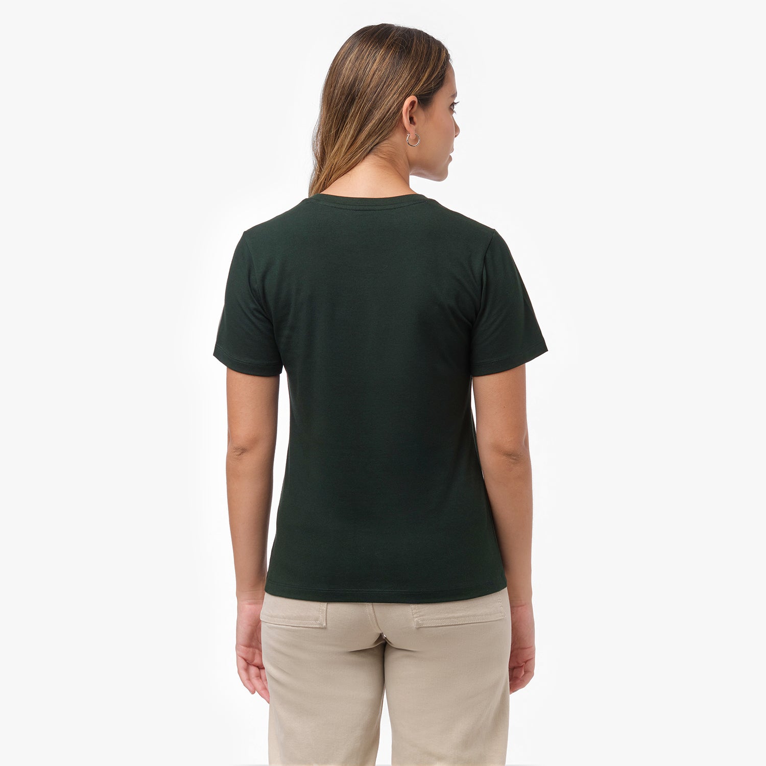 Back view of a woman wearing a plain dark green t-shirt and beige wide-leg pants
