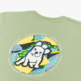 A close-up of the back design on the light green T-shirt, showing the large circular graphic with the dog and tropical background, along with "James Bark Privé Society" text around the circle.