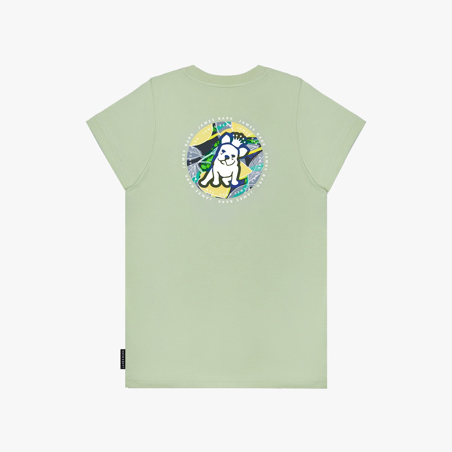 A flat lay of the back of the light green T-shirt, showing the large circular graphic with the tropical background and dog illustration, along with "James Bark Privé Society" text.