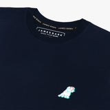 Close-up of the chest area, highlighting the small embroidered logo on the navy blue t-shirt.