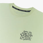 A close-up of the T-shirt’s neckline, showing the inner label that says "James Bark."