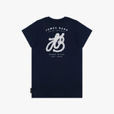 A flat lay of the back of the navy blue T-shirt, showing the large white graphic with the text "James Bark Privé Society" and the rope initials "JB."