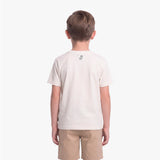 A child viewed from the back wearing a light cream T-shirt with a small black graphic on the upper back