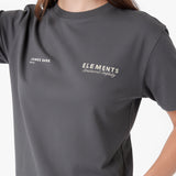 A close-up of a person wearing a gray T-shirt. The shirt features white printed text on the chest, including 'JAMES BARK 2016' on the left chest and 'ELEMENTS Structured Integrity' on the right chest.
