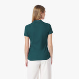 Back picture of a woman wearing a teal polo shirt and white pants on a white background