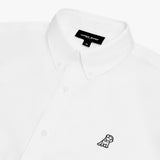 Close-up of a white long-sleeved button-down shirt, showing the collar, white buttons, the brand logo embroidered in black and white, and the neck label