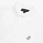 Close-up view of the collar and chest area of a white James Bark oxford shirt, showing the button-down collar, placket buttons, brand label, and the small black embroidered dog logo
