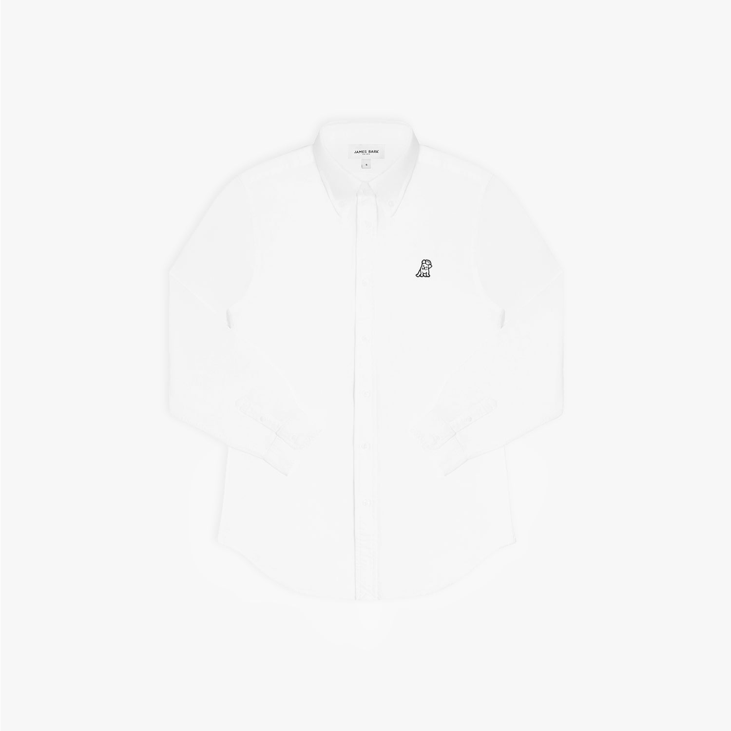 Flat lay photograph of a white long-sleeve button-down oxford shirt with a small black embroidered logo on the left chest and a visible brand label inside the collar, against a white background