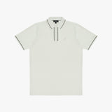 A polo shirt in a light cream or off-white color, featuring thin black piping along the collar, placket, and sleeve cuffs, with a small embroidered logo on the left chest.