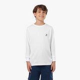 Young boy wearing a white long-sleeved t-shirt with a small dog logo and navy shorts, standing front view