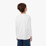 Back view of a young boy wearing the white long-sleeved t-shirt with the small dog logo and navy shorts
