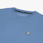 Close-up of the neckline of the light blue shirt, showing the label and detailed stitching.