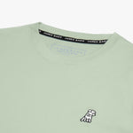 Close-up of the neckline of the light green shirt, showing the label and detailed stitching.