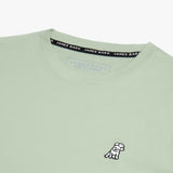 Close-up of the neckline of the light green shirt, showing the label and detailed stitching.