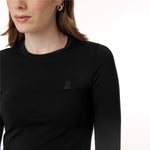 A close-up of the black top, focusing on the small embossed dog logo on the chest. The detailed stitching and fabric texture are visible, highlighting the quality of the garment.