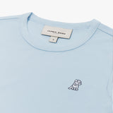 Close-up of the neckline and small dog graphic on the chest of the light blue long-sleeve shirt.