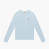 Flat lay of the light blue long-sleeve shirt, showing the small dog graphic on the chest.