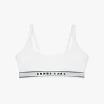 Flat-lay view of a white bralette with the "James Bark" logo on the elastic band.