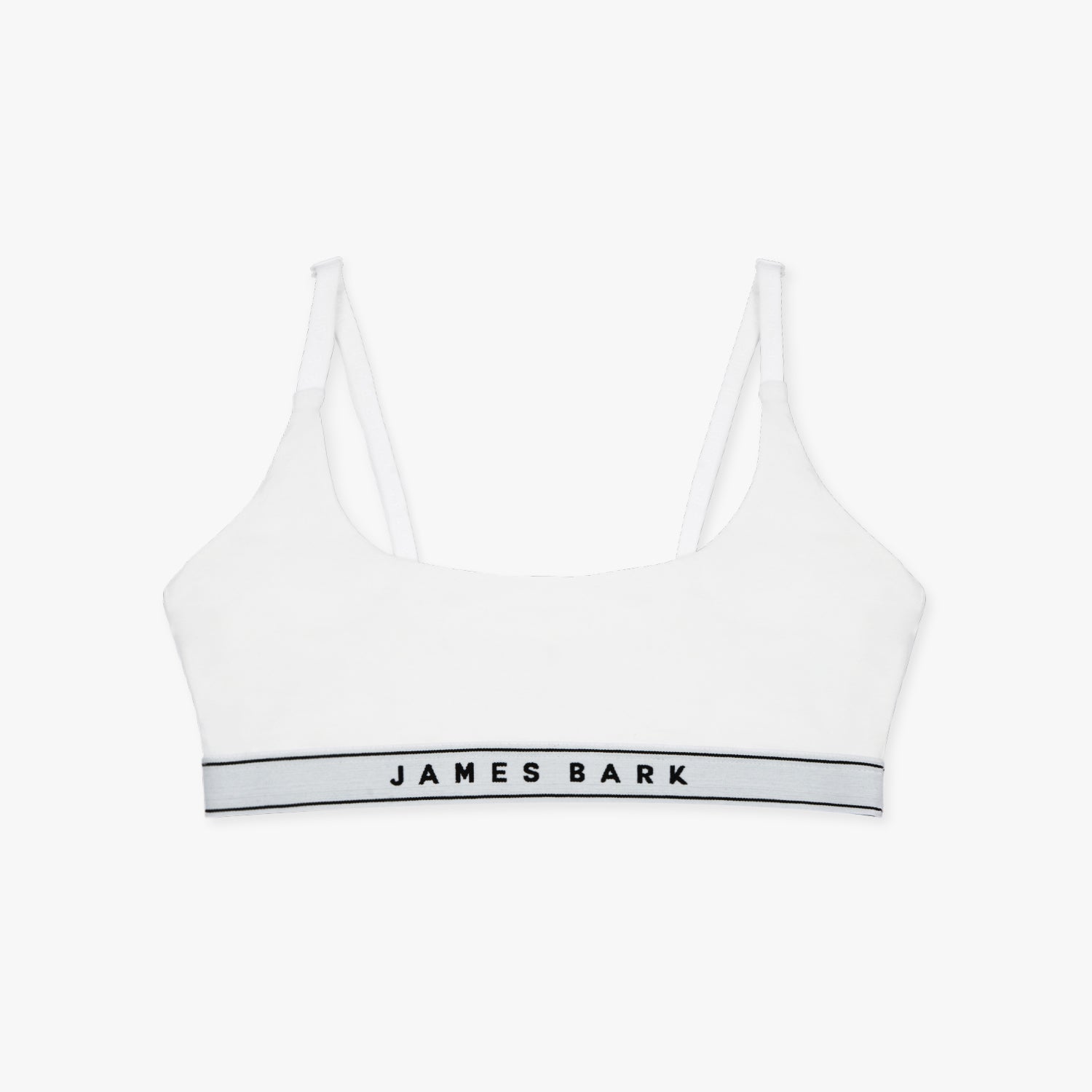 Flat-lay view of a white bralette with the "James Bark" logo on the elastic band.