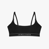 Flat-lay view of a black bralette with the "James Bark" logo on the elastic band.