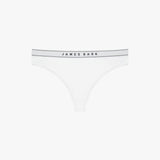 Flat-lay view of a white thong with the "James Bark" logo on the waistband.