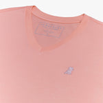 Neckline view of a James Bark light pink v-neck t-shirt featuring the brand label and signature embroidered dog logo.