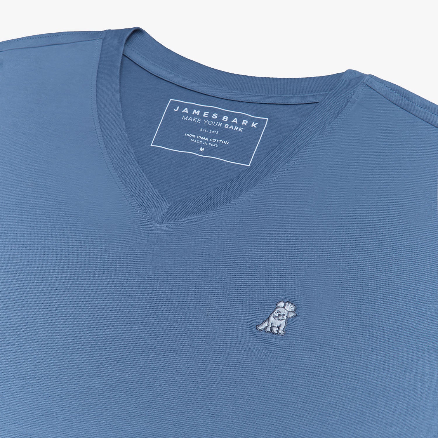 Close-up of the neckline and shoulder seam of the blue V-neck t-shirt, showing the stitching and fabric texture.