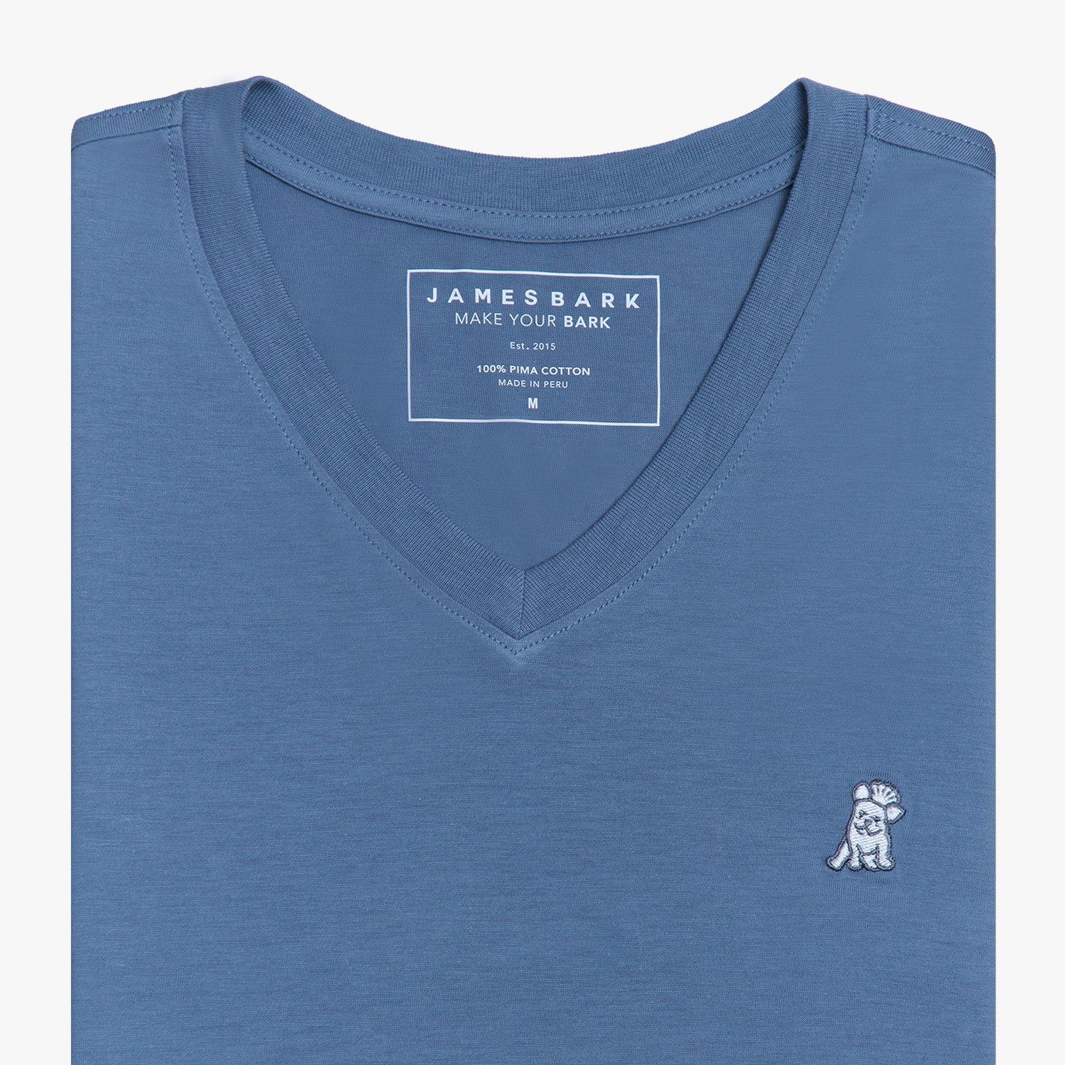 Close-up view of the blue V-neck t-shirt laid flat, highlighting the collar and small embroidered logo.