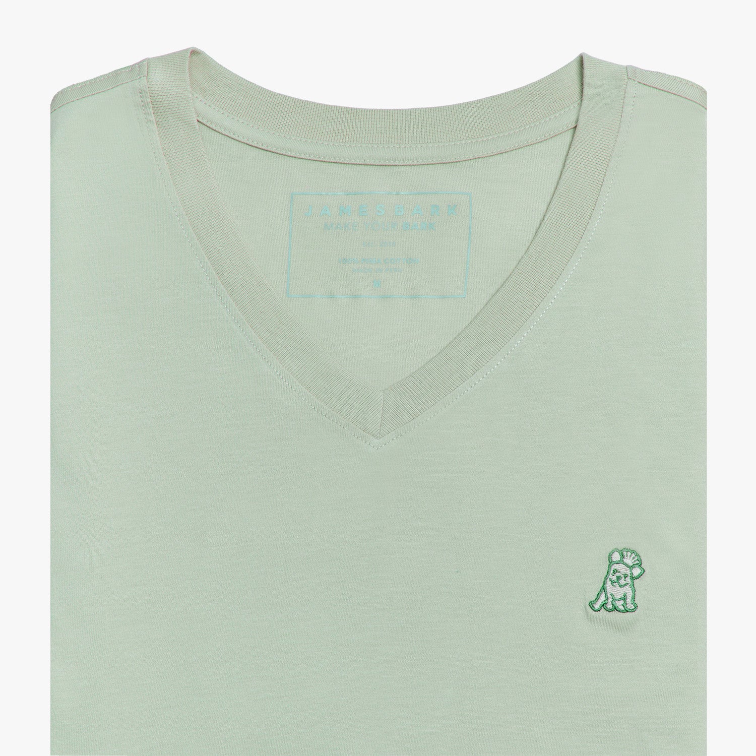 Close-up view of the mint green V-neck t-shirt laid flat, highlighting the collar and small embroidered logo.