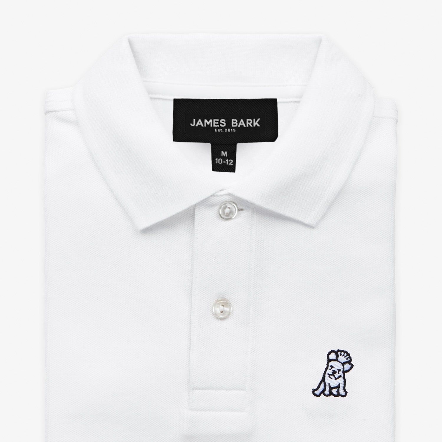 Close-up of the white polo shirt’s collar area, showing the button placket and a small embroidered logo on the chest.