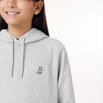 Close-up side view of the child wearing the gray hoodie, highlighting the embroidered dog logo on the chest and the fabric texture.