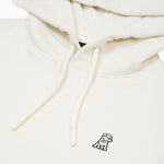 Close-up of the embroidered dog logo and drawstring on the cream-colored hoodie, emphasizing the fine details.