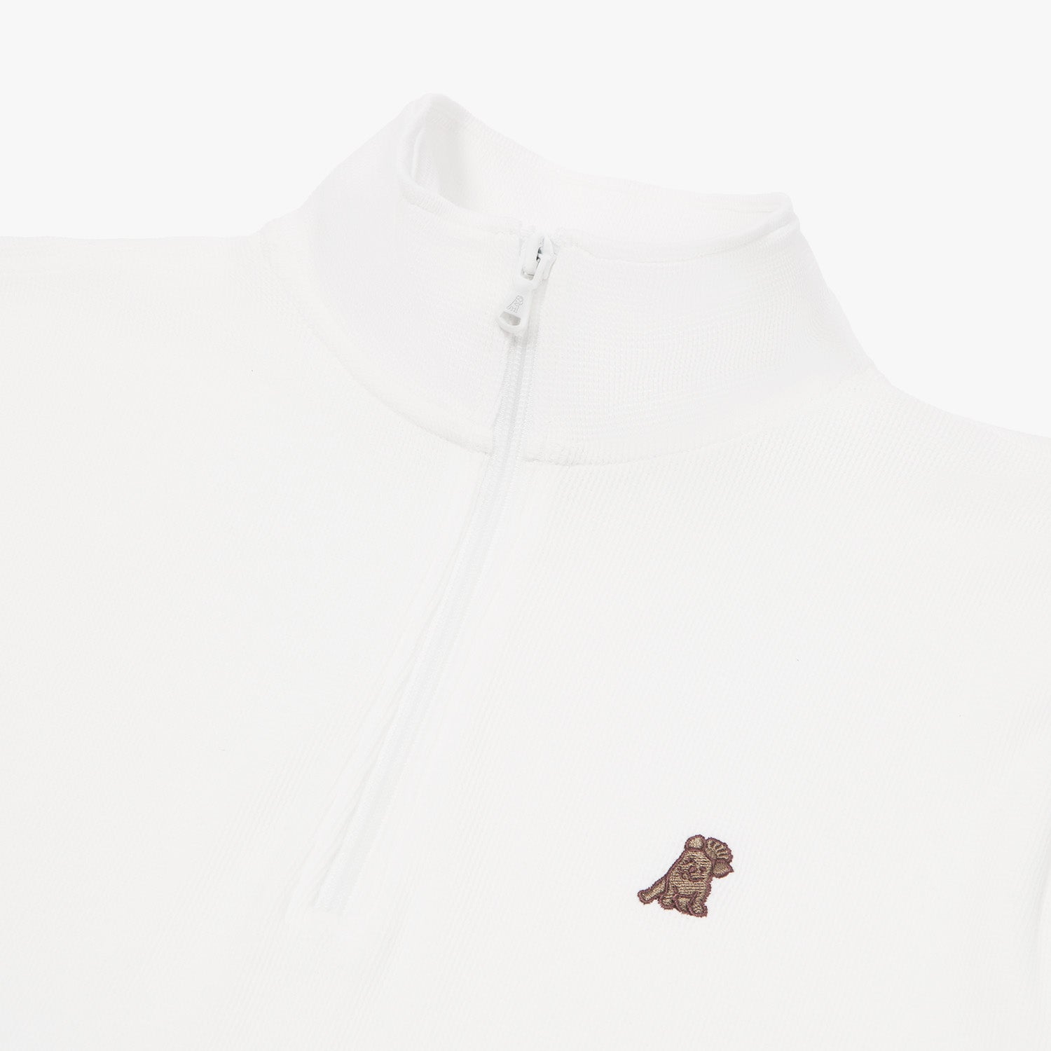 Close-up of a white quarter-zip pullover featuring a high collar and a white zipper. The chest area has an embroidered dog logo in brown, adding a subtle design detail